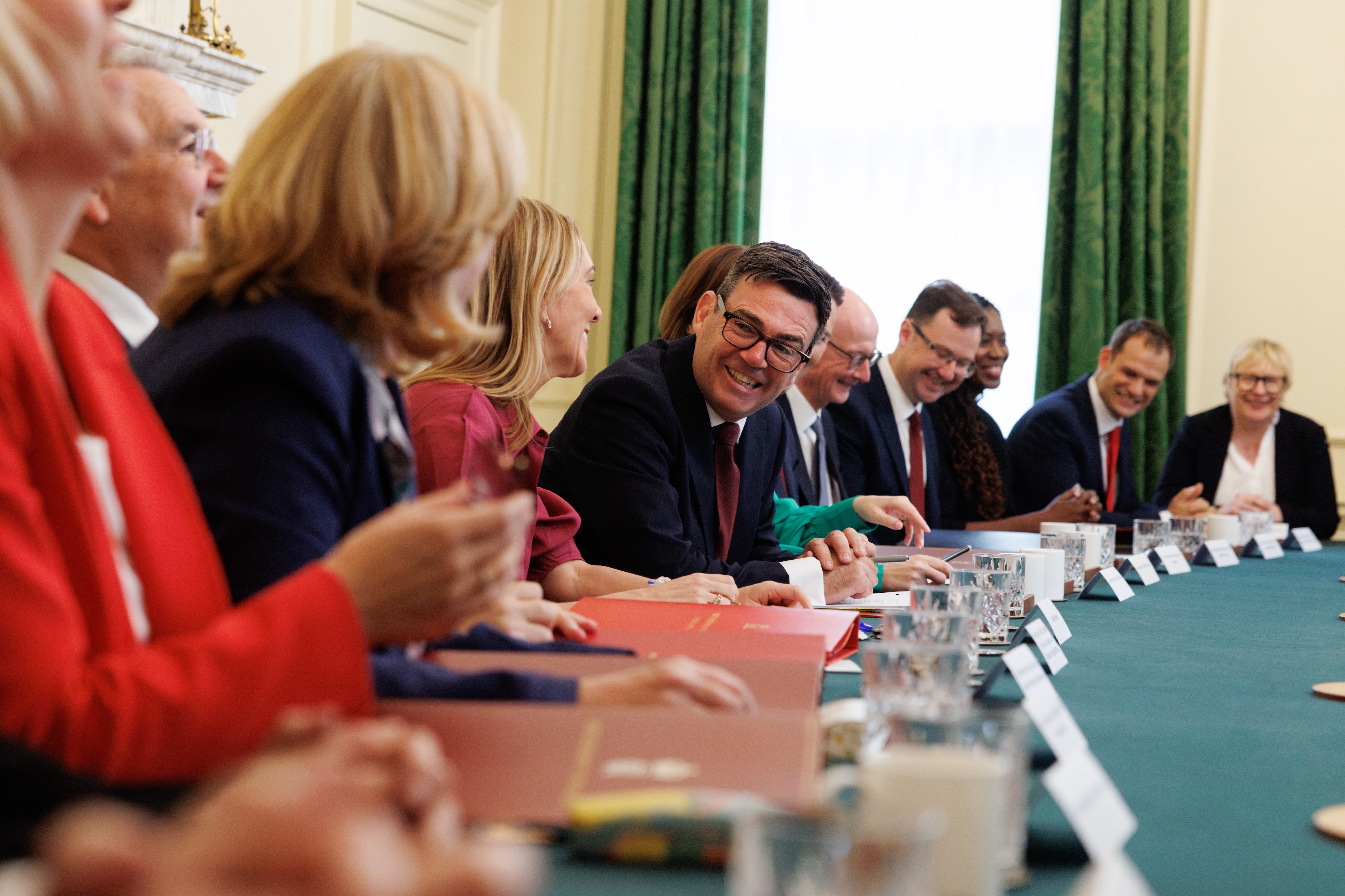 Andy Burnham's first cabinet meeting Andy Burnham surrounded by ministers for his first cabinet meeting