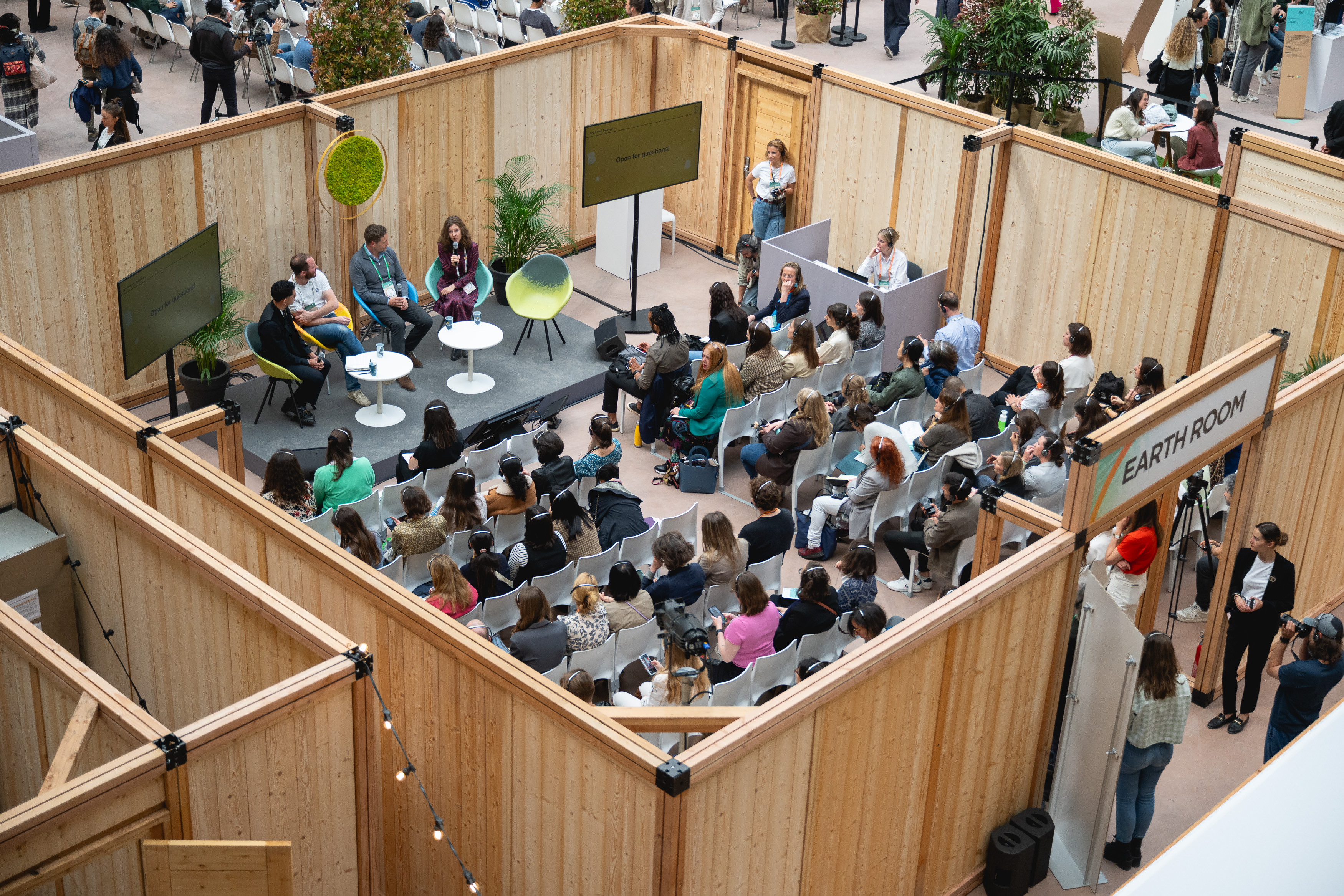 Audience of people listening to a panel of speakers at ChangeNOW conference