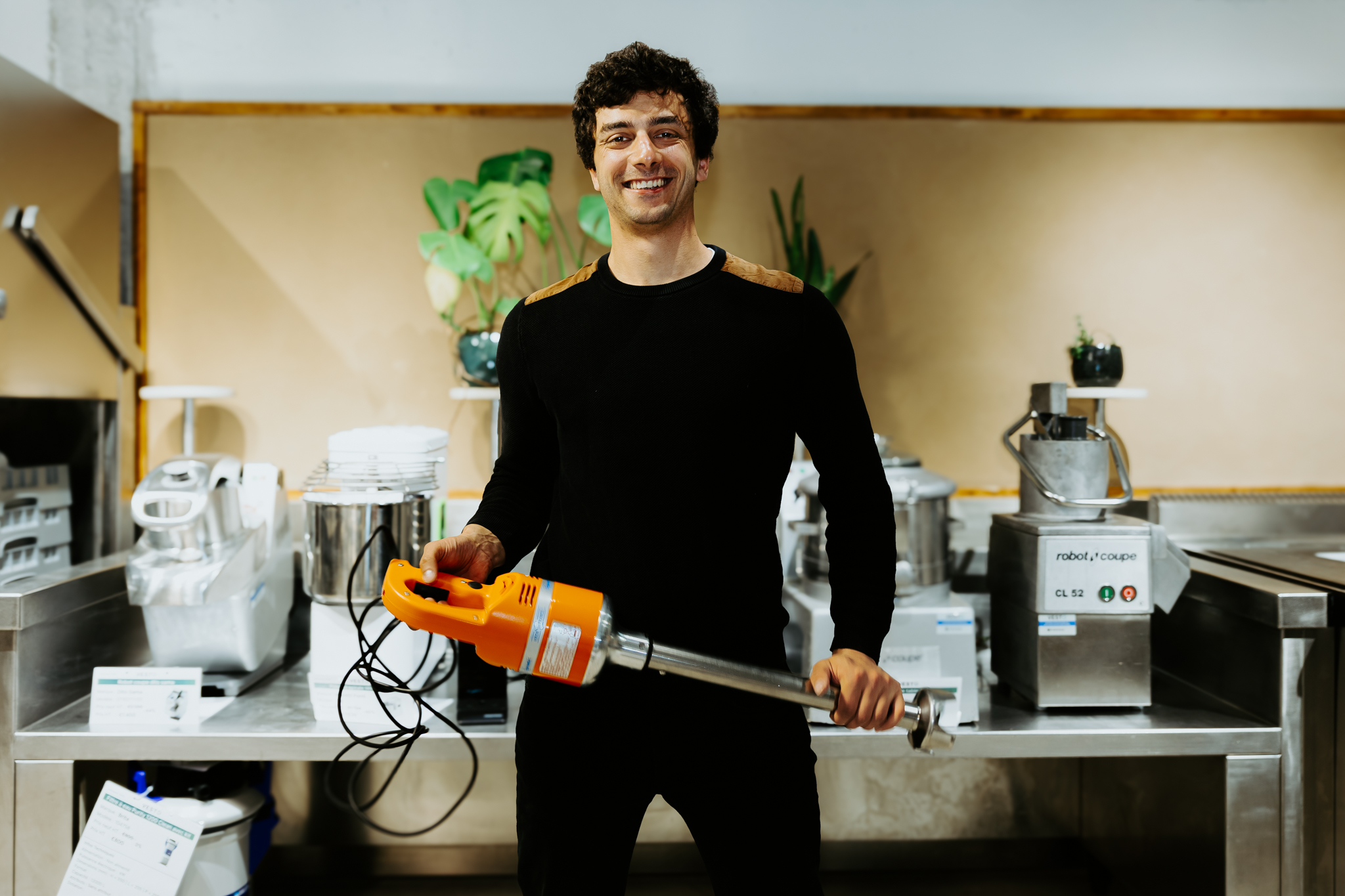 Vesto social enterprise circular economy Portrait of man in front of cooking machinery