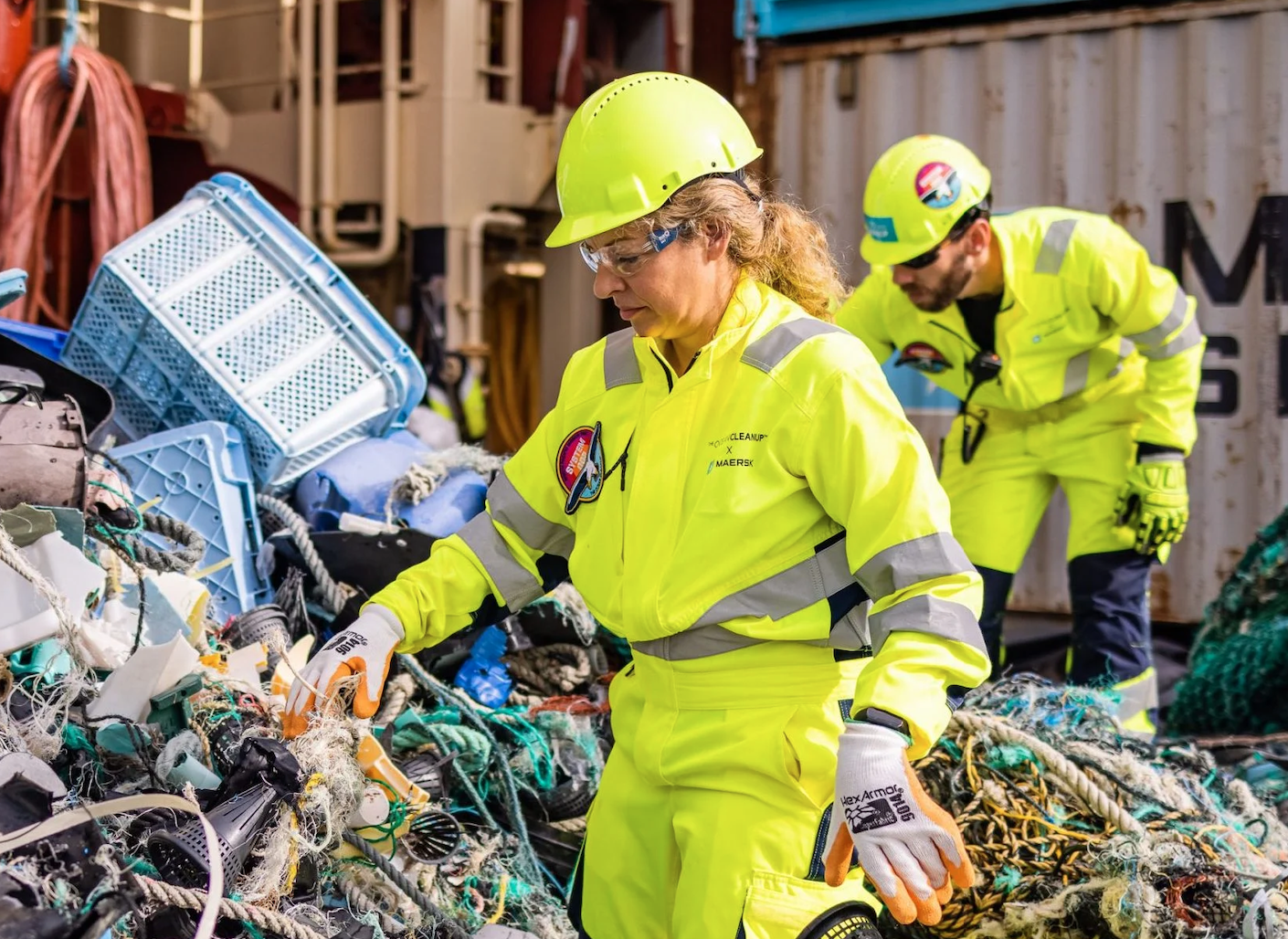 Woman in a hard hat sorting litter