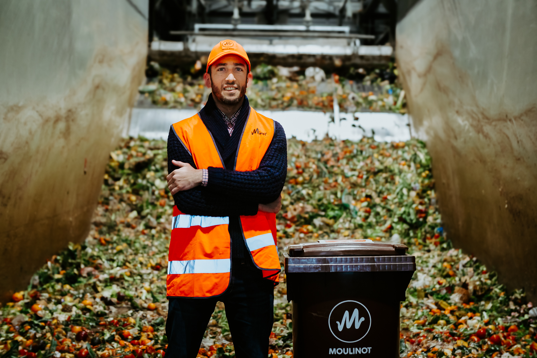 Moulinot social enterprise waste management circular economy employment France Photo of man in orange high-visibility jacket standing in front of pile of food waste