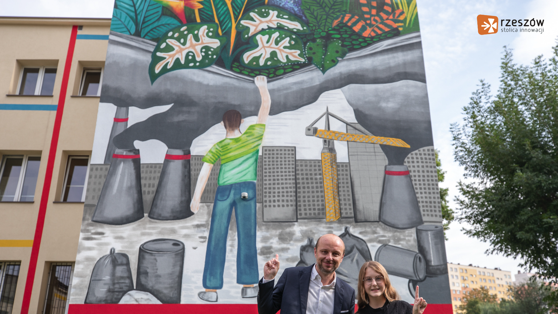 Rzeszów mayor Konrad Fijolek in front of mural