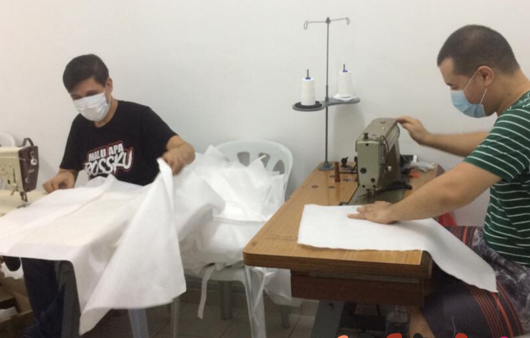 Social Textiles tailors at work making PPE scrubs sets 