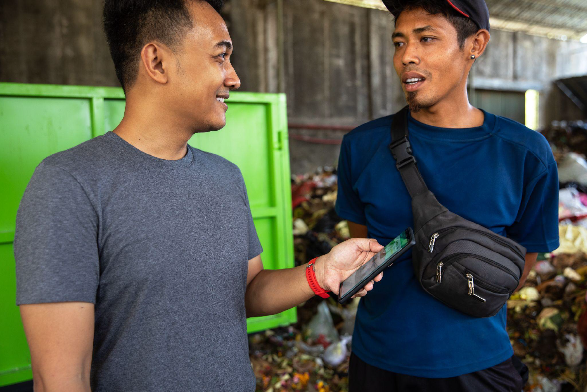 Two men in Bali using a smartphone