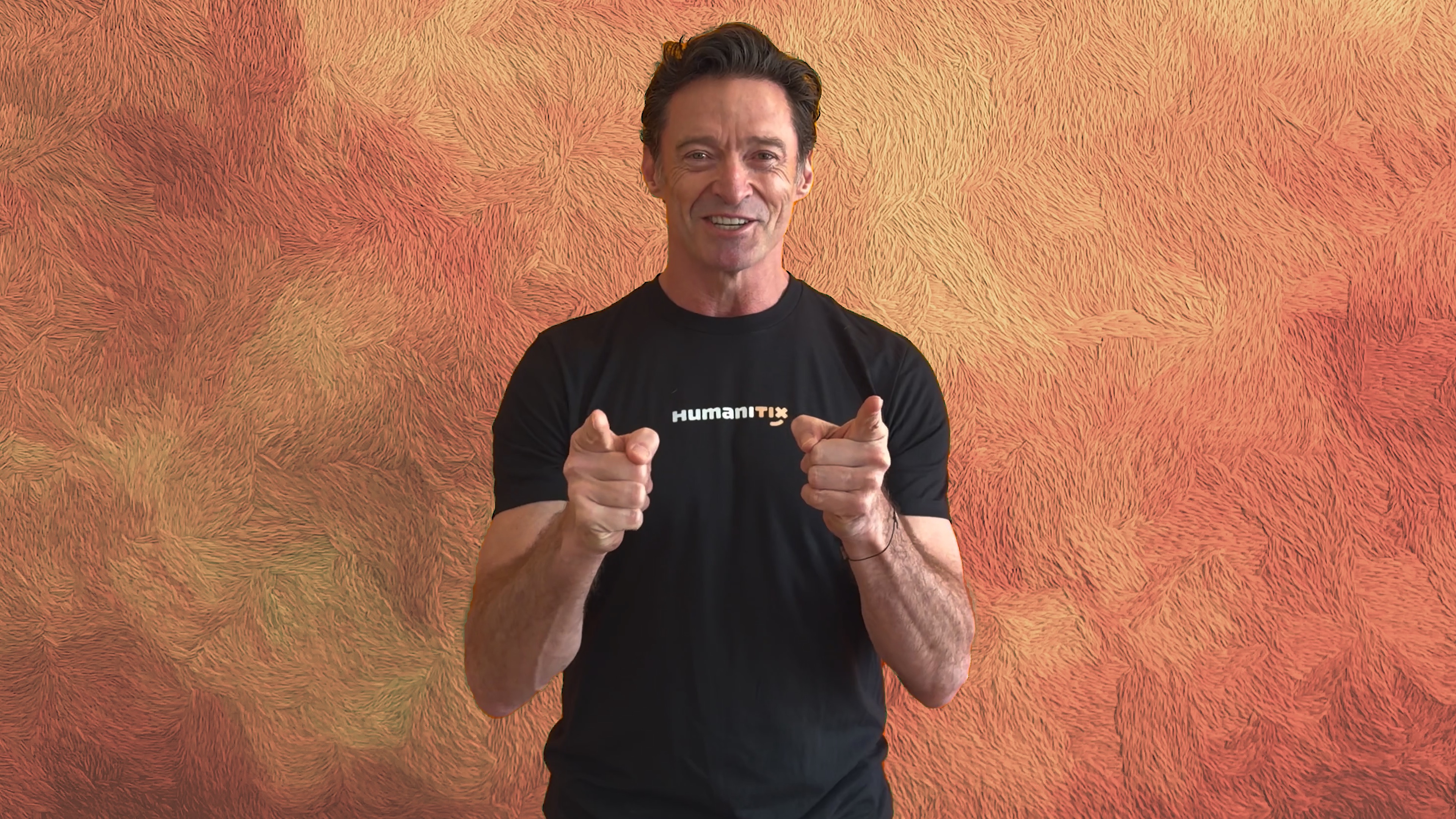 Hugh Jackman wearing a T-shirt with Humanitix logo