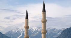 Minarets against a backdrop of mountain peaks