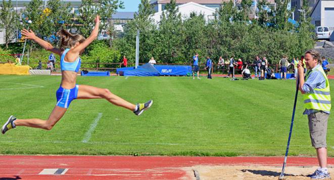 An athlete does long jump