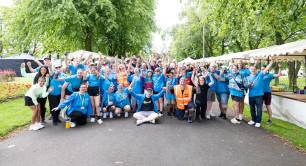 Picture of a group of people wearing blue T Shirts