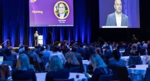 Amit Bouri speaks on stage