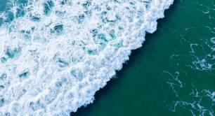 overhead aerial shot of wavy blue sea