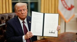 Donald Trump signs an executive order