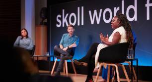 Speakers taking part in a panel discussion at the Skoll World Forum 2023