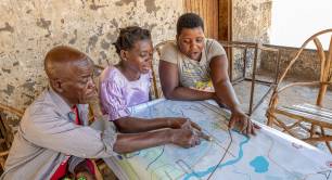 A group of people look at a map