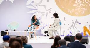 Xananine Calvillo Ramirez and Hilda Liswani speaking on stage at ChangeNOW 2026