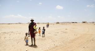 People standing in Kenya desert during 2017 drought