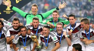 Germany&amp;#039;s winning World Cup football team celebrate