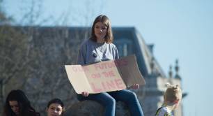 Girl with placard - our future is on the line