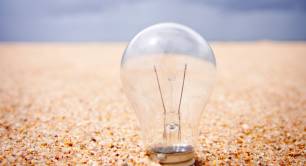 Lightbulb in sand by glen-carrie-unsplash