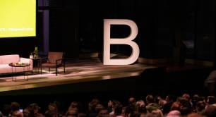 a stage featuring a giant B logo