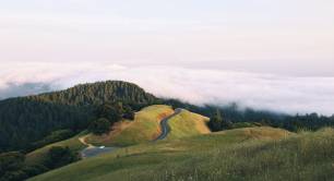 Mountains_countryside_road_grass_sky