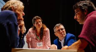 A conversation between speakers at the P4NE 2026 conference
