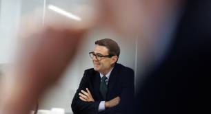 Andy Burnham sat down during meeting