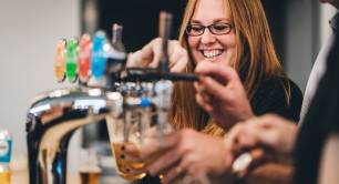 Toast Ale - woman pouring pint