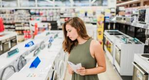 Woman buying washing machine