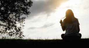 Woman alone looking into the horizon