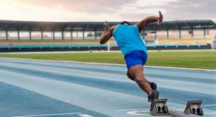 athlete starting a race in a stadium