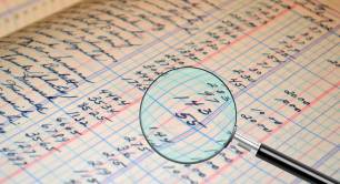 Audit with magnifying glass