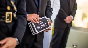 Man holding top secret box