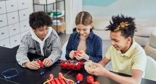 Children doing robotics together